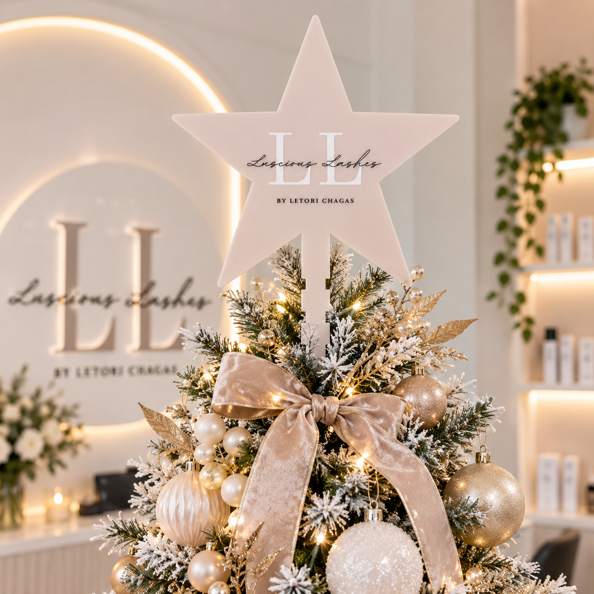 Personalised business logo Christmas tree star topper for Luscious Lashes, displayed on a modern salon Christmas tree with elegant neutral decorations.