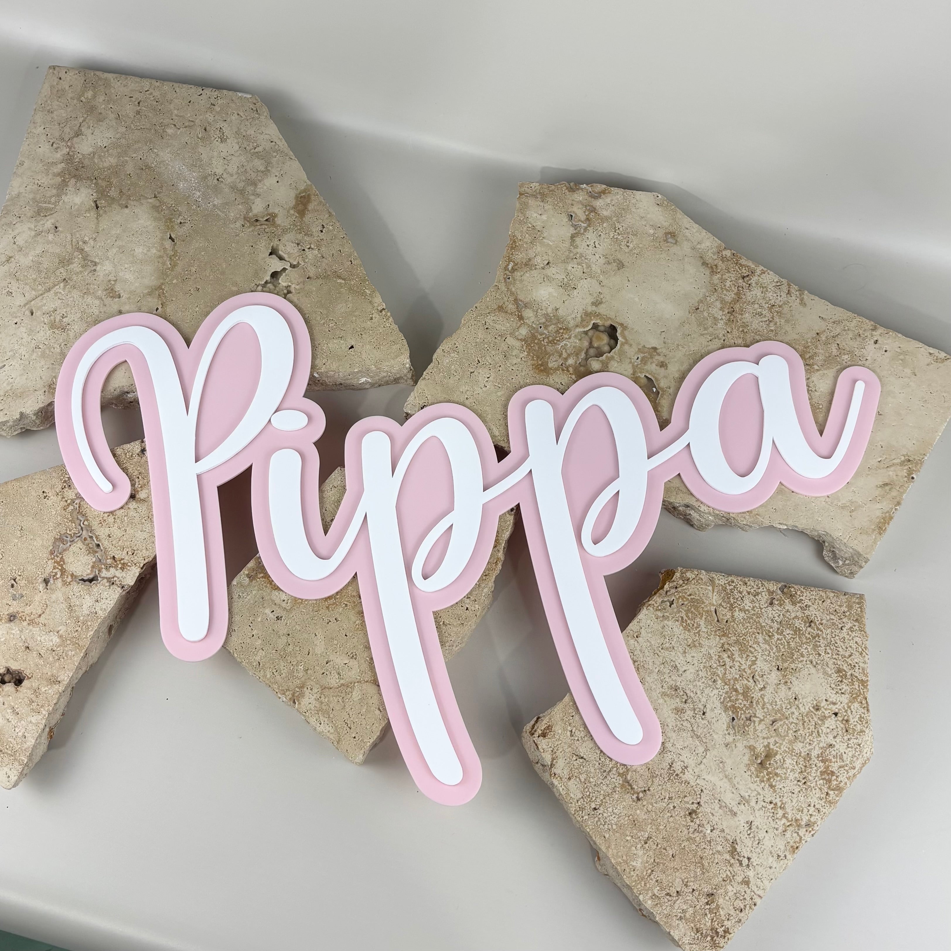 Personalised acrylic name sign Pippa, layered pink and white script name plaque, custom kids room name sign Australia, laser cut acrylic wall decor, nursery name sign for girls, modern pastel bedroom decor sign, custom name plaque for wall or shelf display