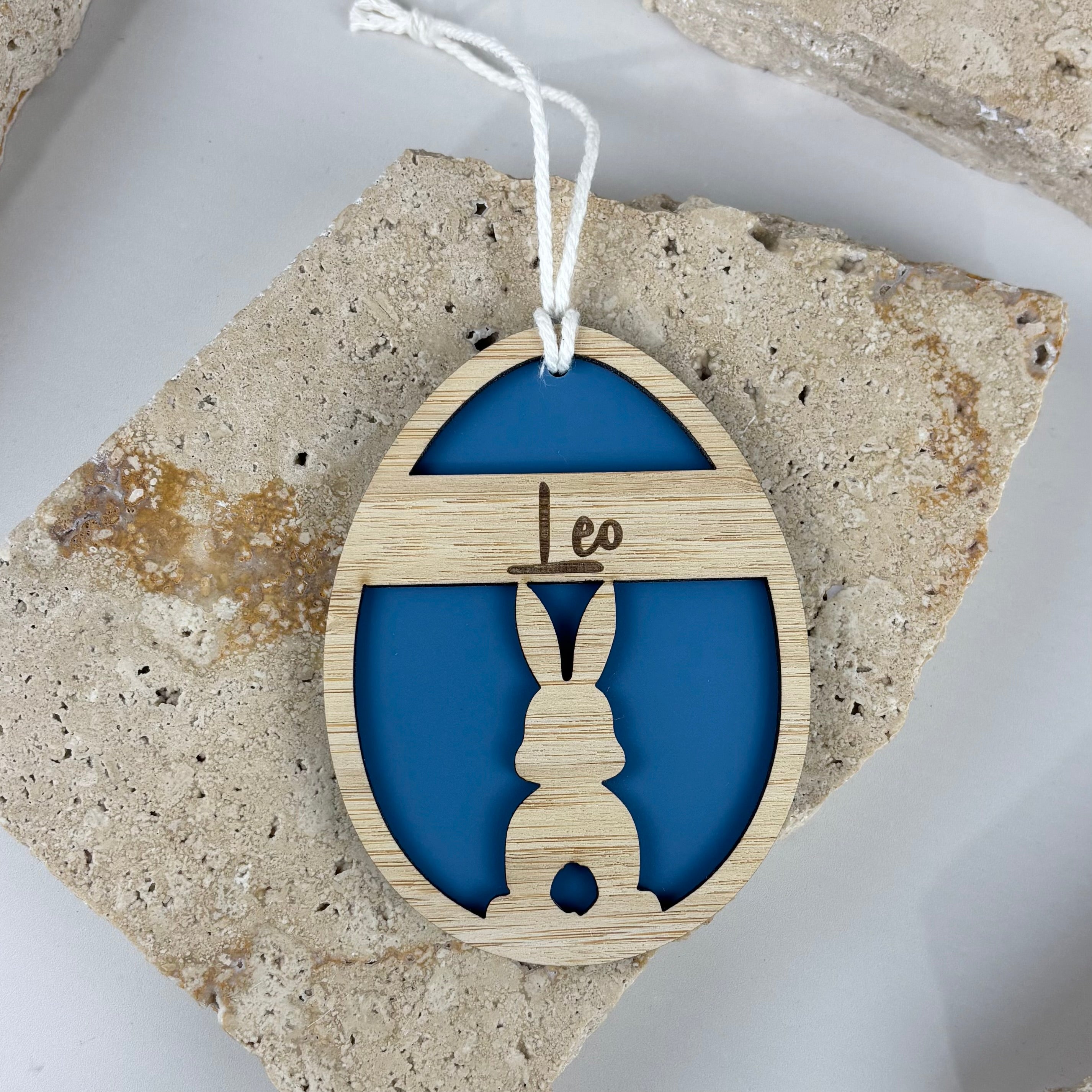 Personalised Easter bunny tag with name Leo, laser cut bamboo and acrylic Easter decoration, custom Easter basket tag Australia, hanging bunny ornament with blue acrylic backing, engraved kids Easter tag, reusable Easter gift tag for baskets and hampers