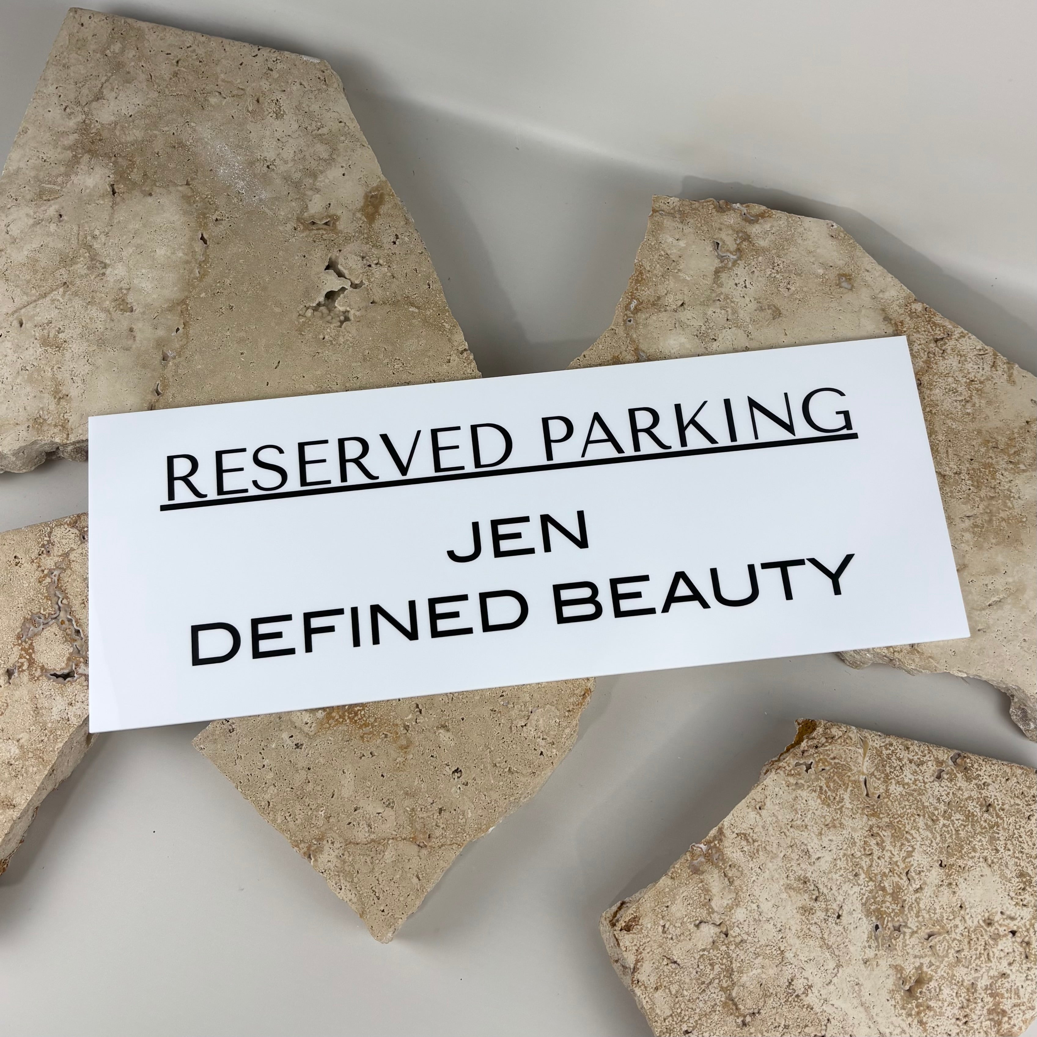 Custom acrylic reserved parking sign, personalised business parking plaque “Jen Defined Beauty”, white outdoor parking signage with black lettering, salon reserved car space sign Australia, durable weatherproof parking sign for businesses, modern rectangular acrylic parking display sign