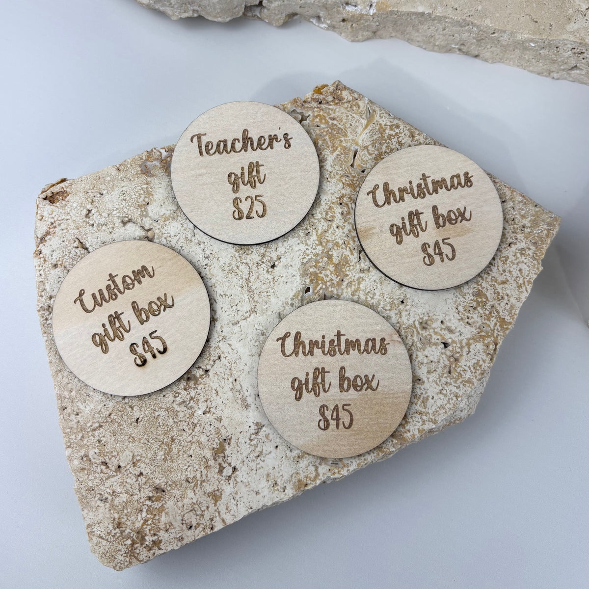 Engraved timber price discs for market stalls and retail displays, personalised with product names and prices for clear, professional product signage.