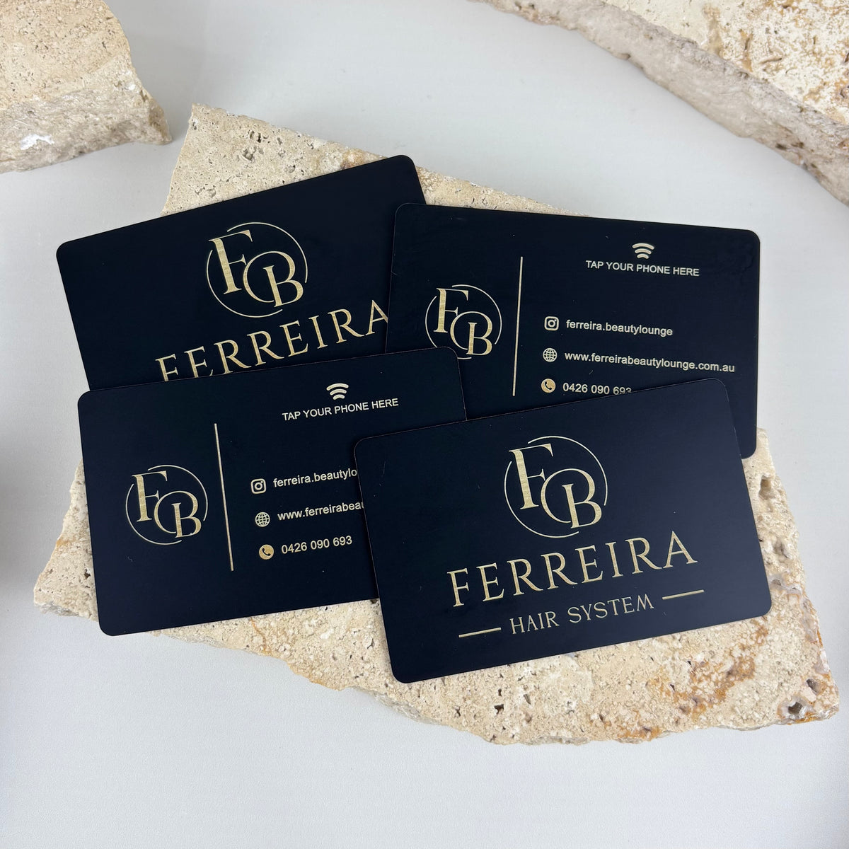 Custom NFC business cards with black acrylic, gold branding and tap-to-connect technology for quick access to social media, website and contact details.
