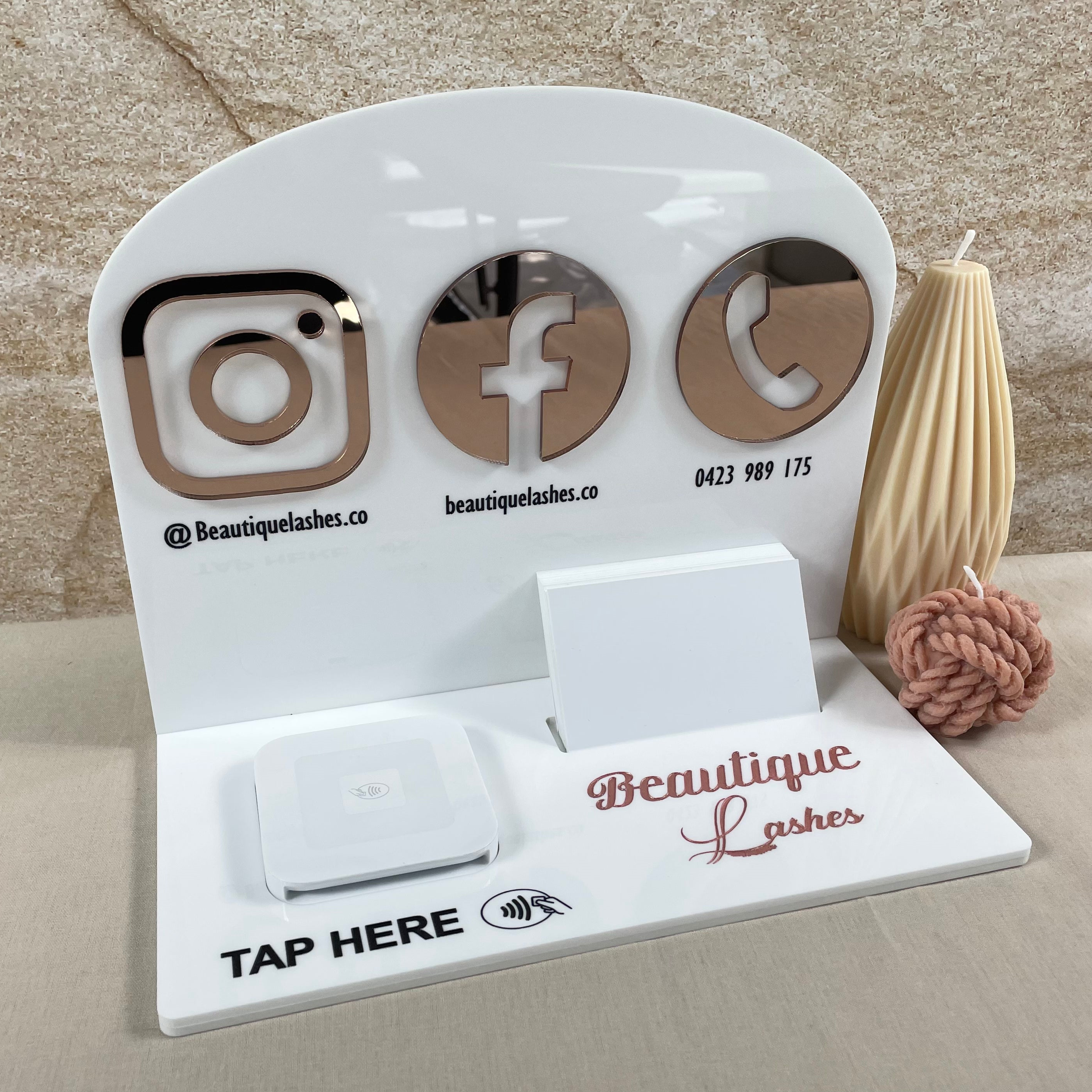 White acrylic social media display with engraved Facebook icons