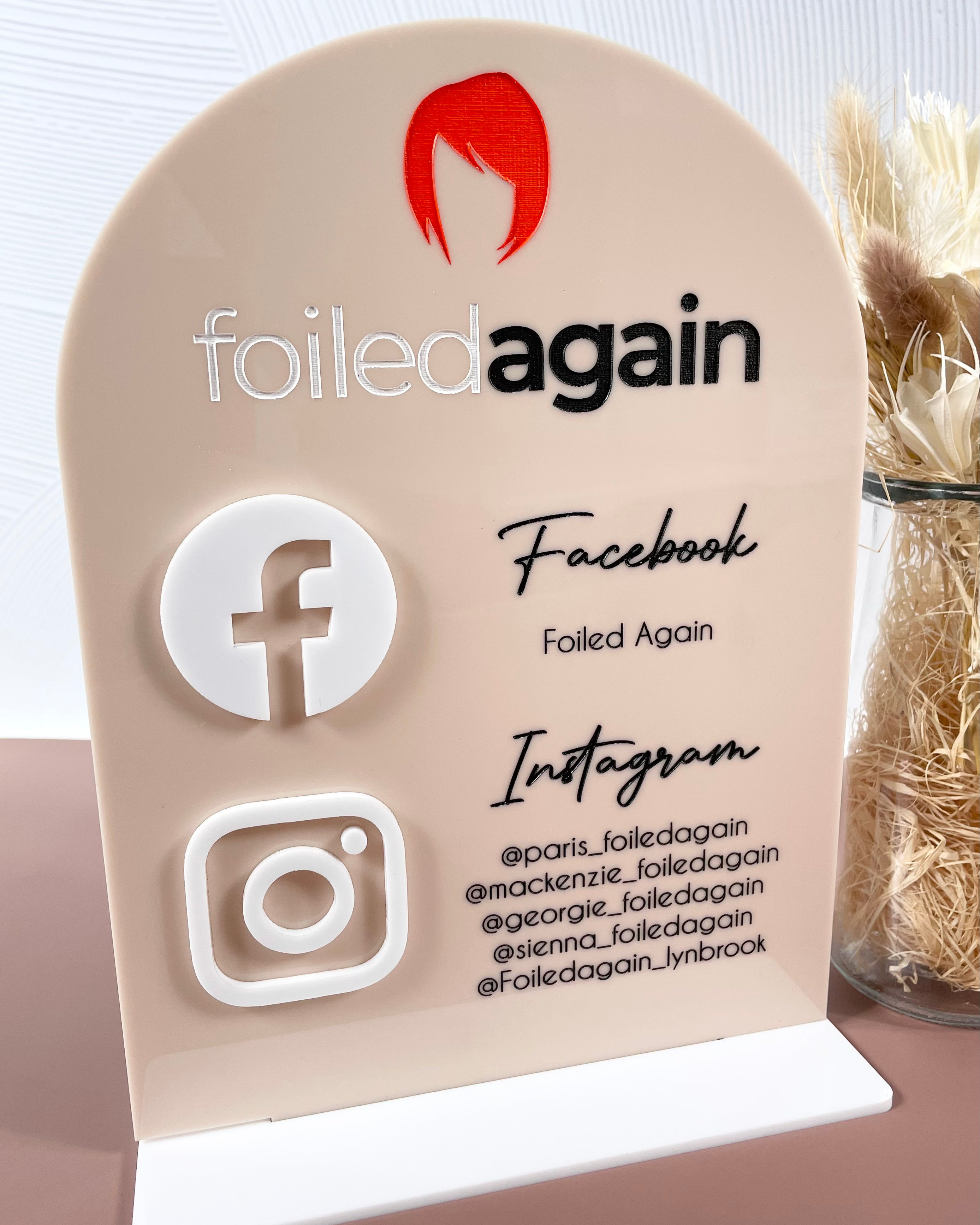 Branded business sign with Instagram and Facebook links for hair salon