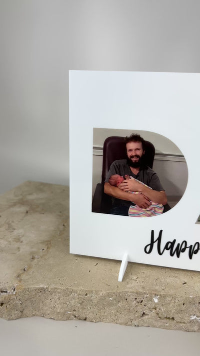 Video of personalised Father’s Day photo sign with custom images inside DAD cutout, acrylic photo display gift for dads, perfect for Father’s Day celebrations.