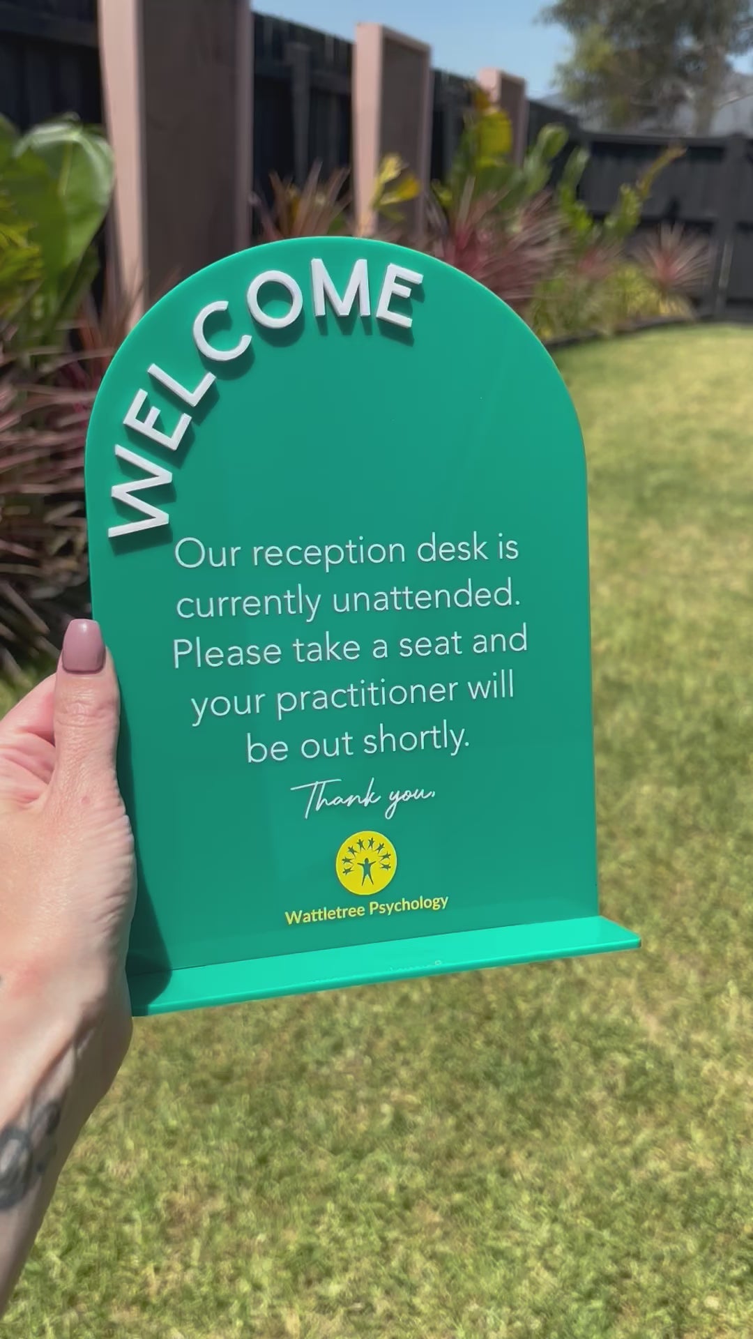 Green welcome sign for desk check-in at beauty or medical clinic. Video