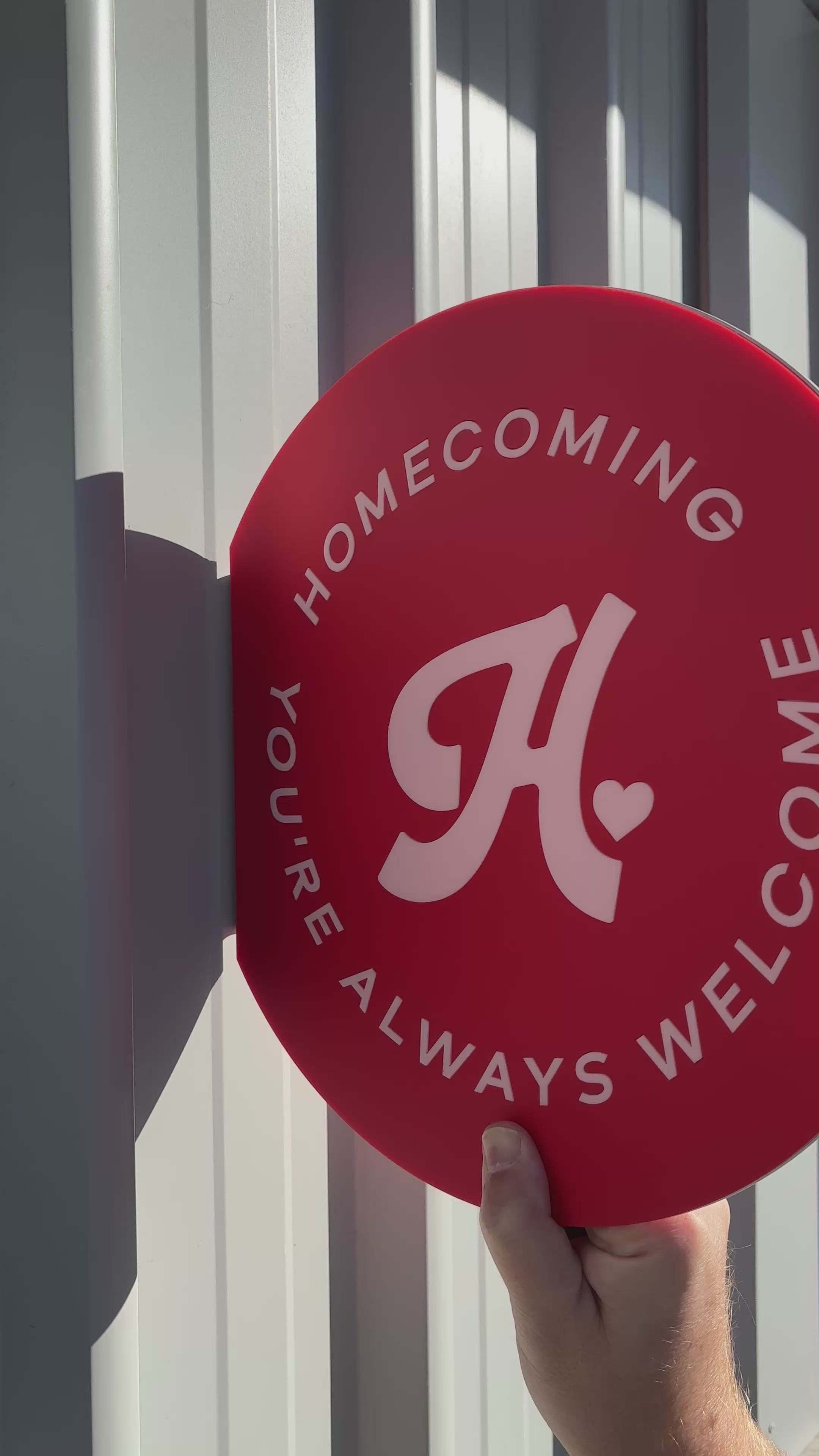 Custom red circular business sign with white logo and text