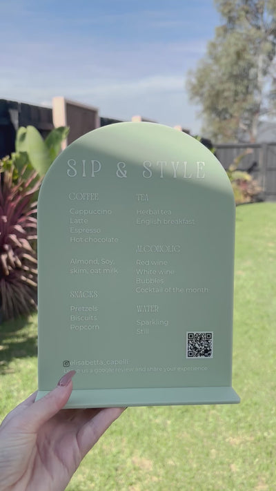 Green arched acrylic product sign with custom QR code and business branding. Video