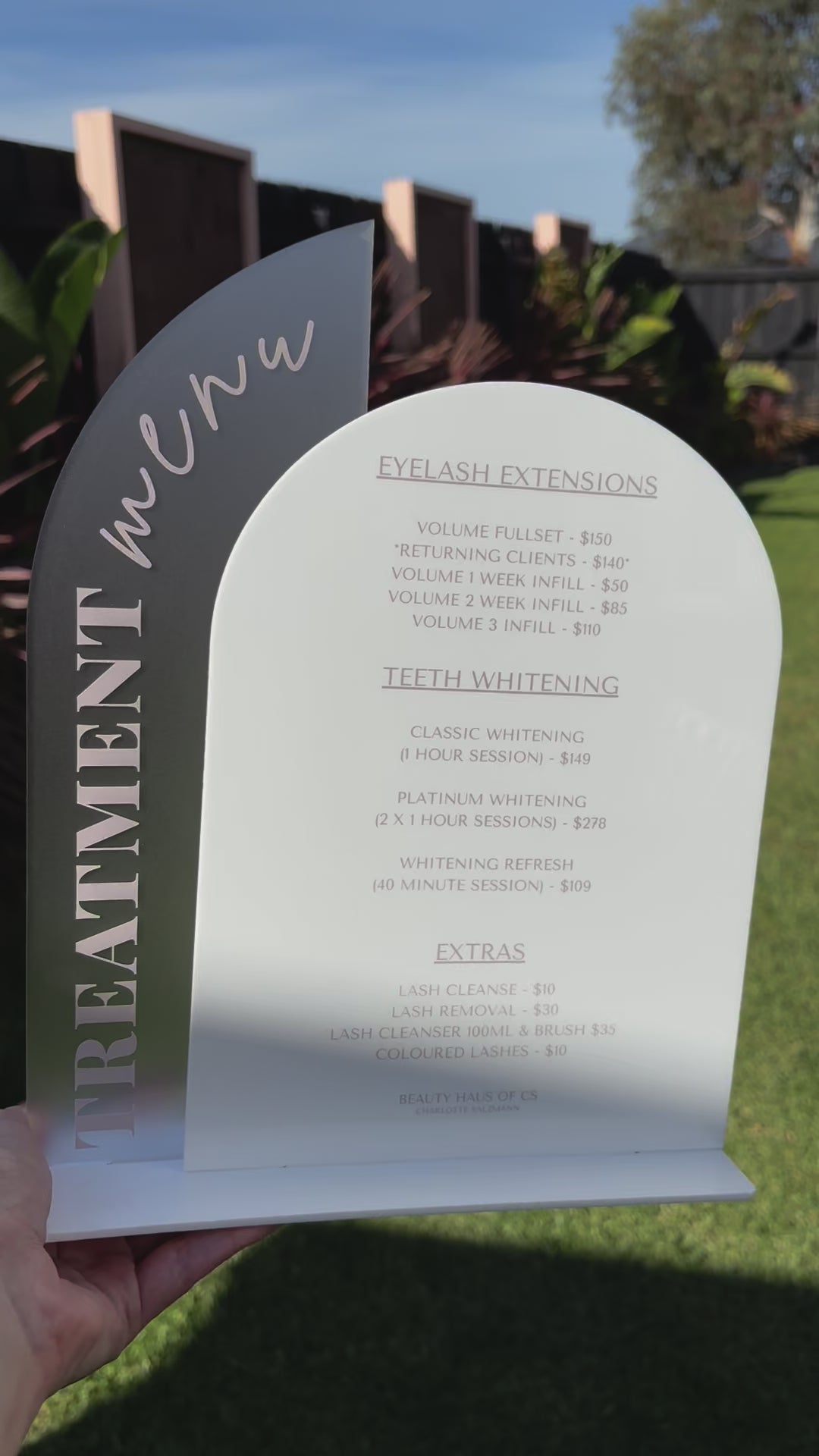 White layered acrylic business info stand with curved arch design