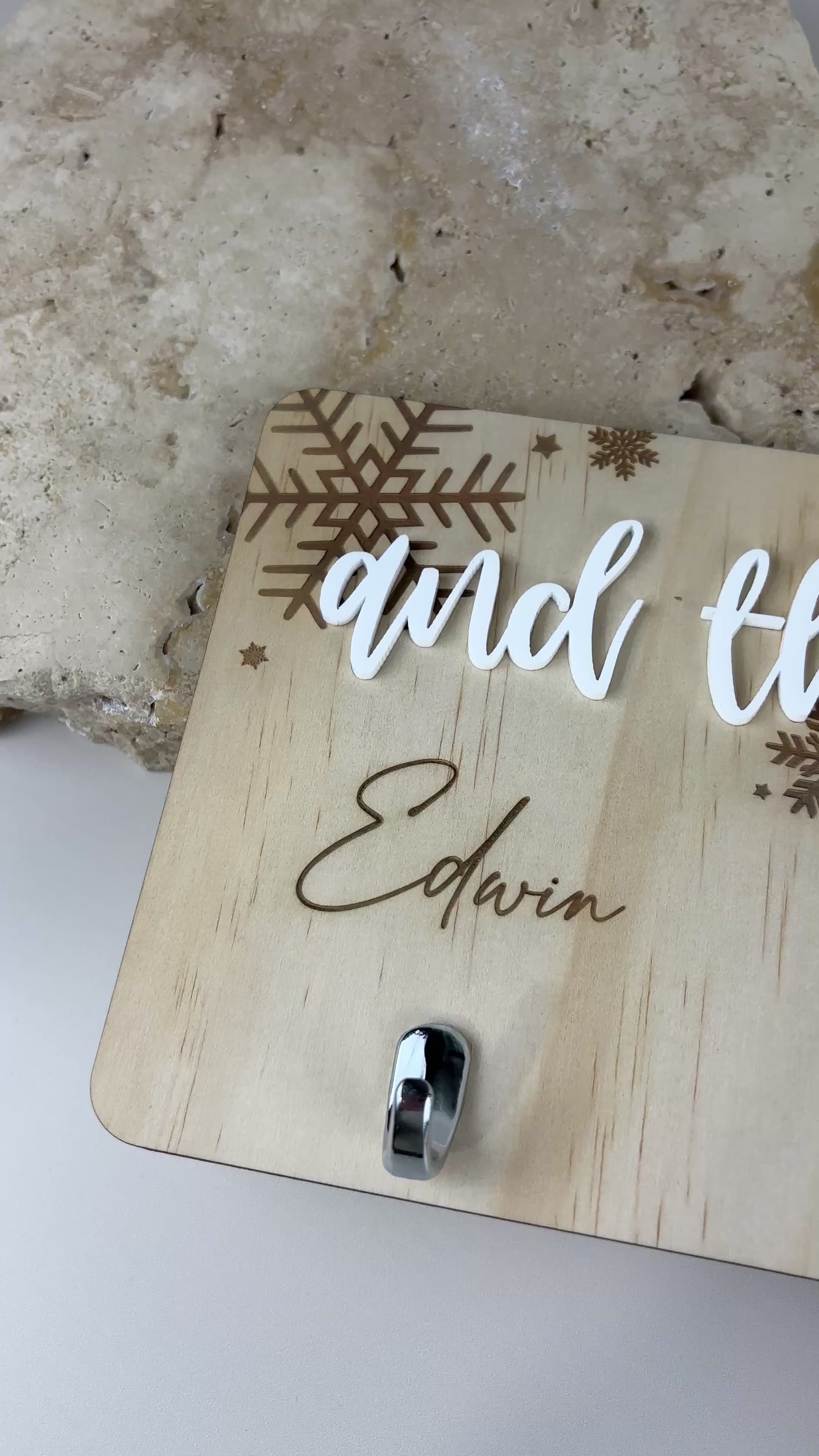 Custom wooden stocking holder with engraved family name and hooks for Christmas stockings
