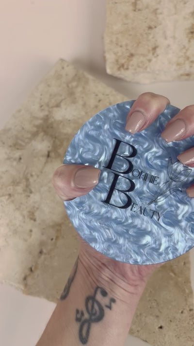 Video Close up of personalised nail display stand featuring printed business branding