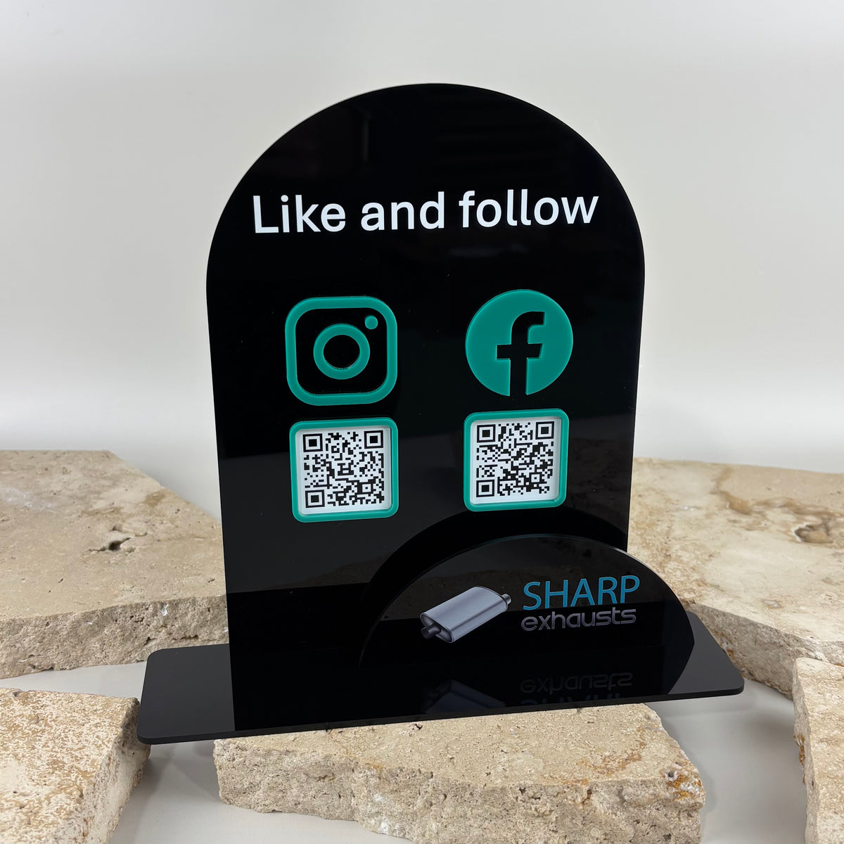 Custom black acrylic social media QR code stand with Instagram and Facebook icons, QR codes and business card holder.