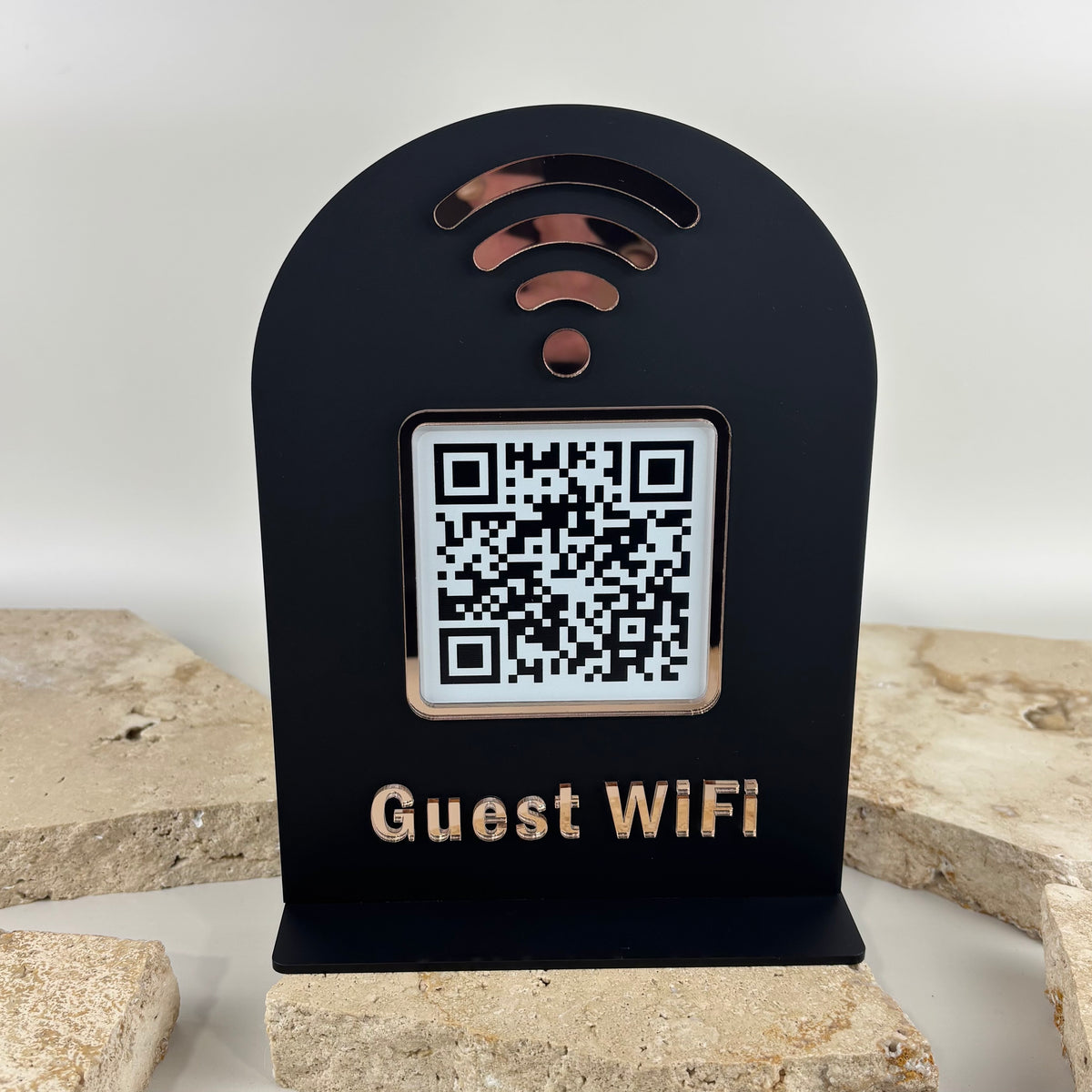 Custom black acrylic guest WiFi sign with QR code, rose gold mirror details and freestanding base.