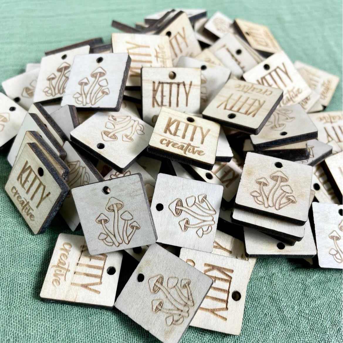 Square engraved timber tags with logo design for craft projects