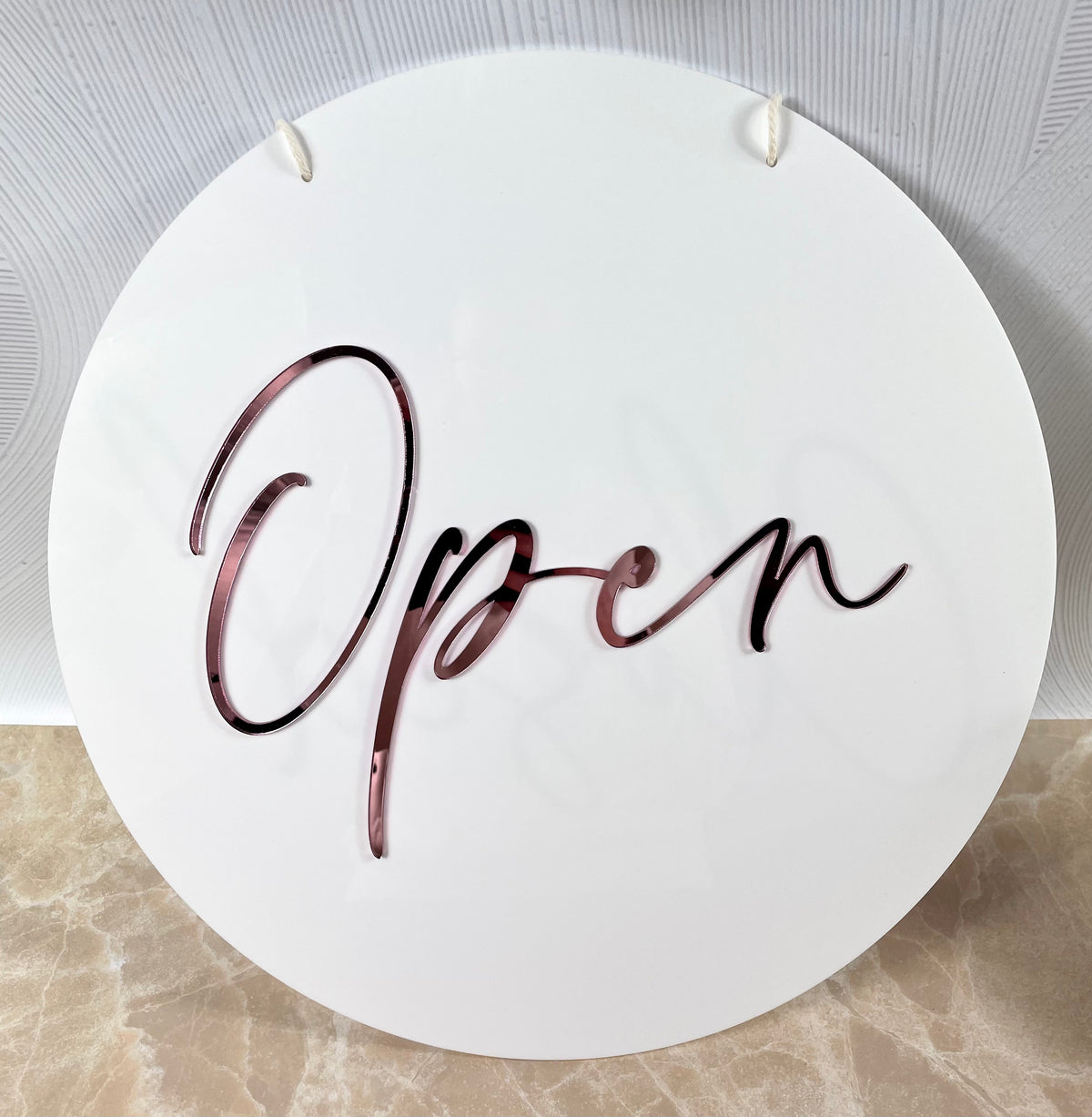 white and pink open sign