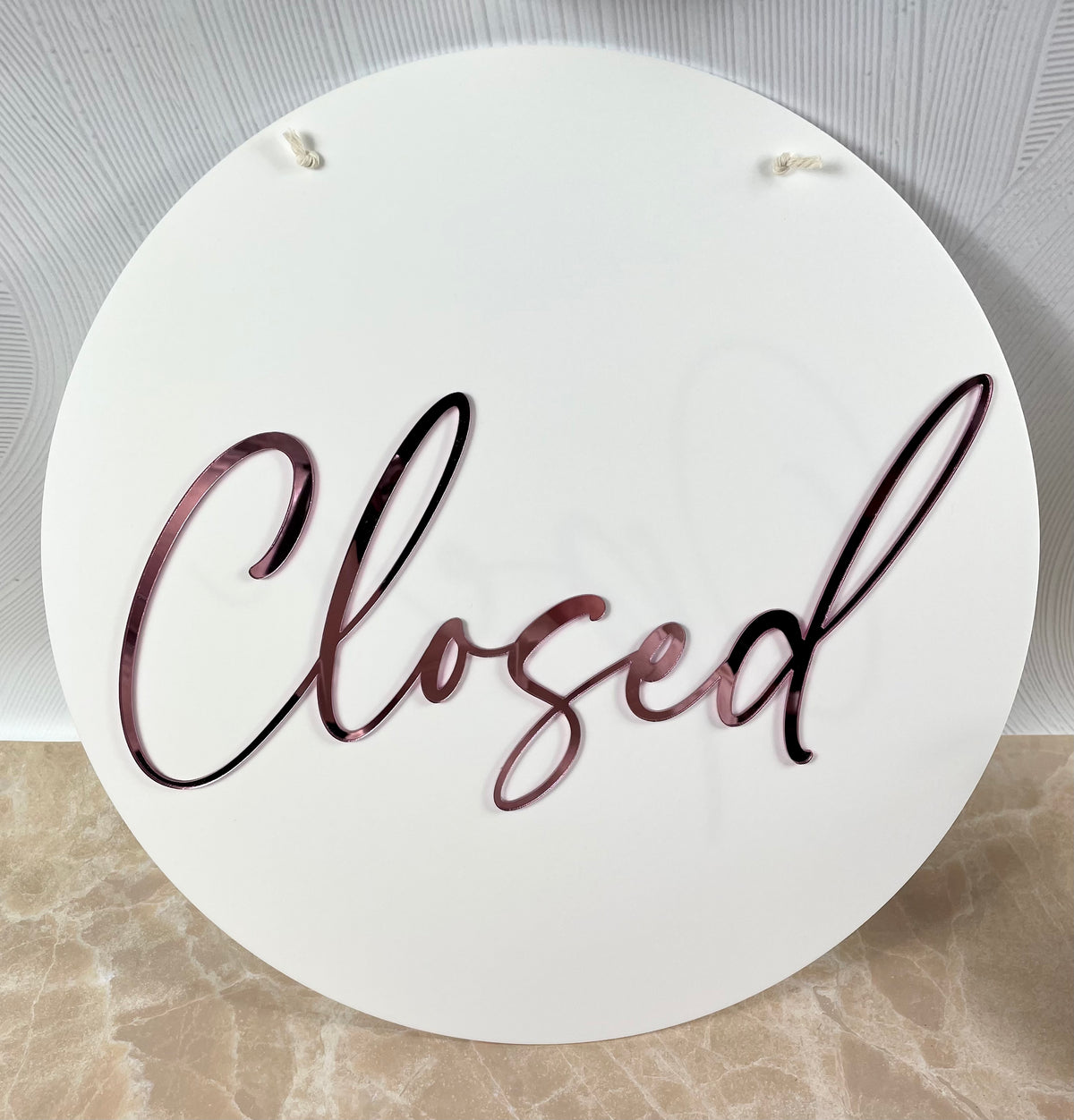 white and pink closed sign