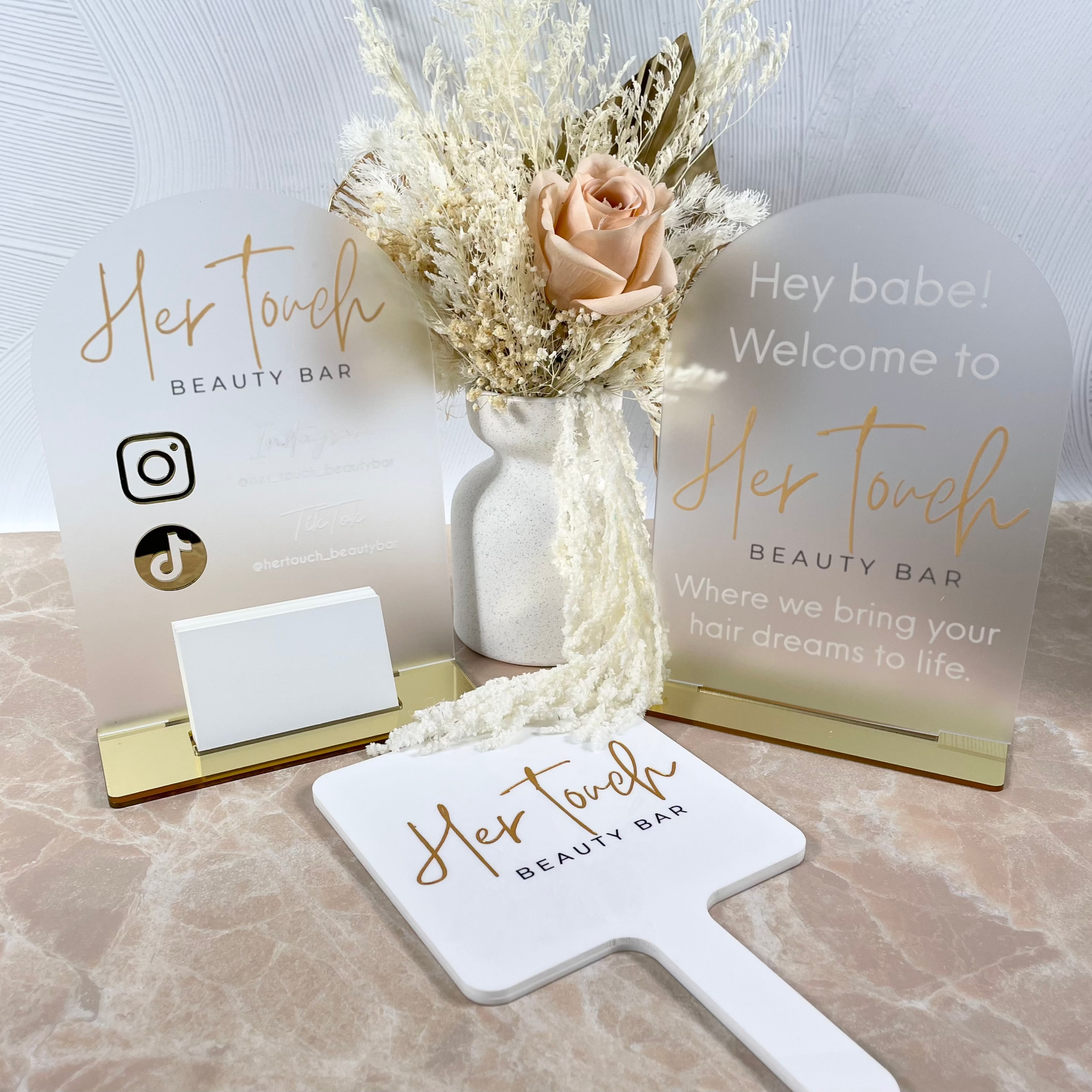 White and gold acrylic business accessories with fresh flower styling