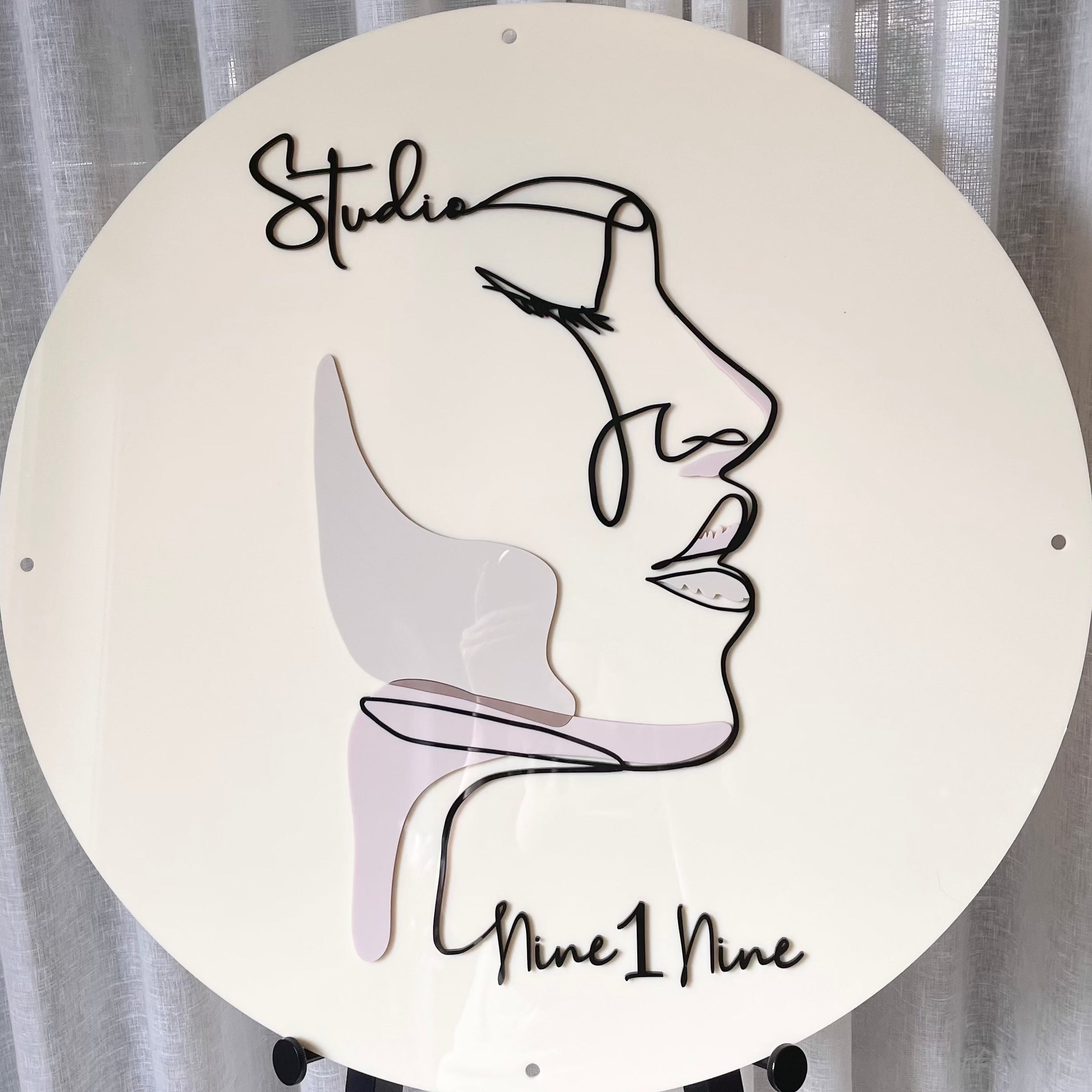 Cream round acrylic business sign with face