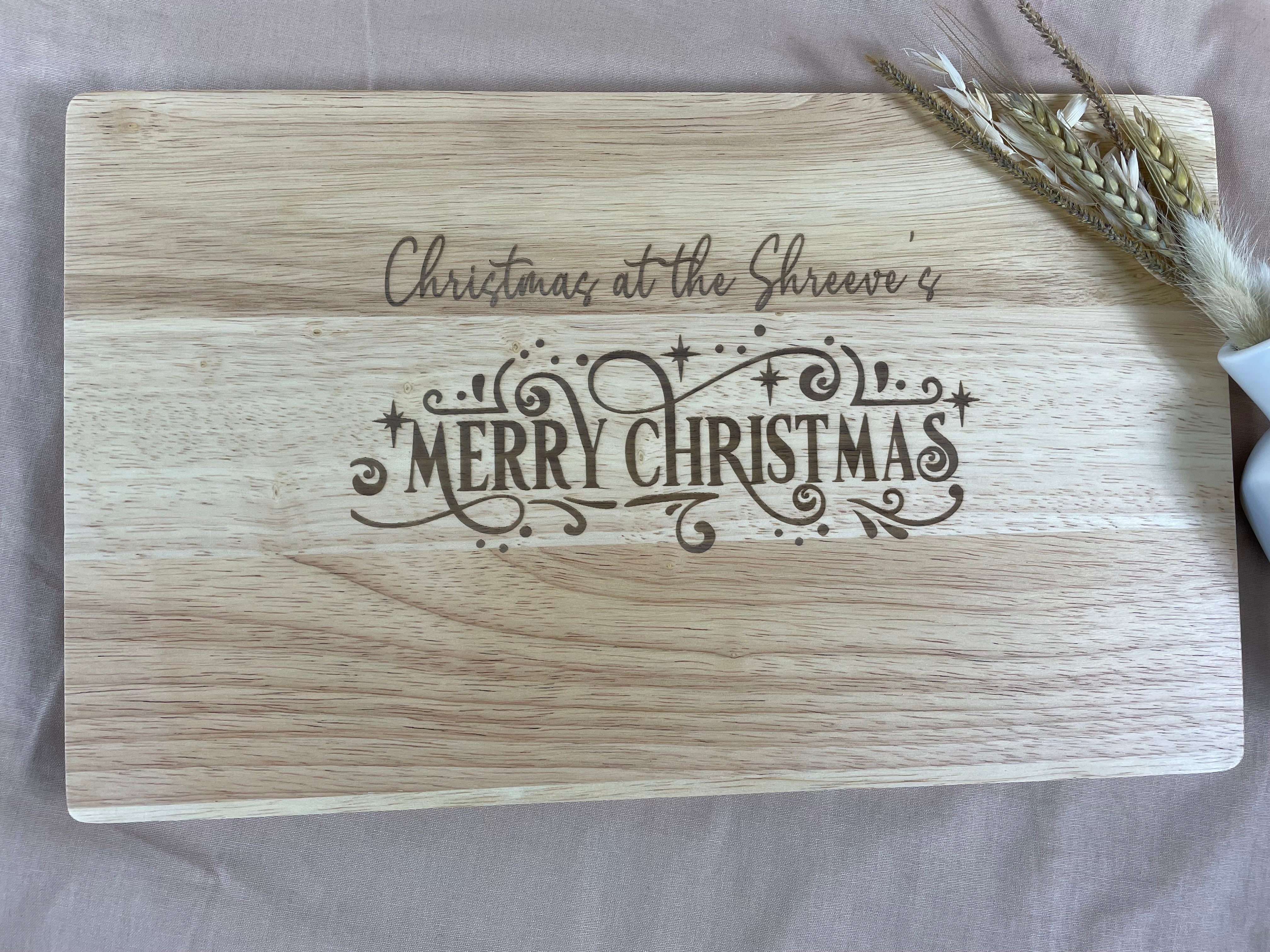 Engraved wooden Christmas chopping board with Merry Christmas design and personalised message option
