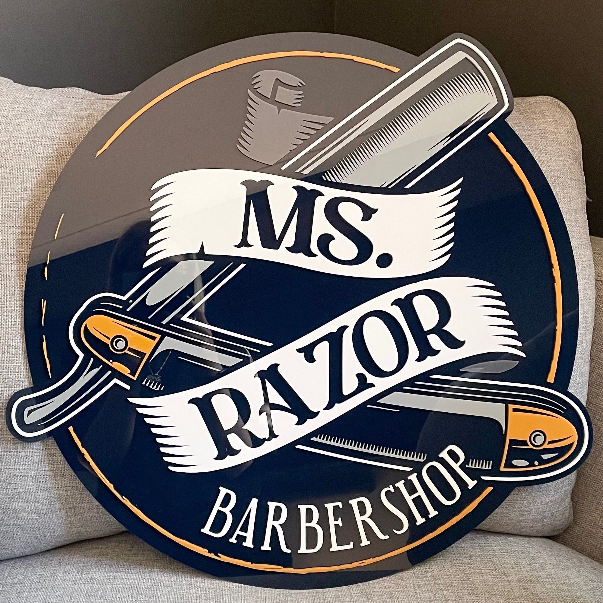 barbershop round acrylic sign with layered blue and gold. ms razor